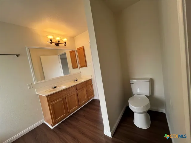a bathroom with a toilet and a sink