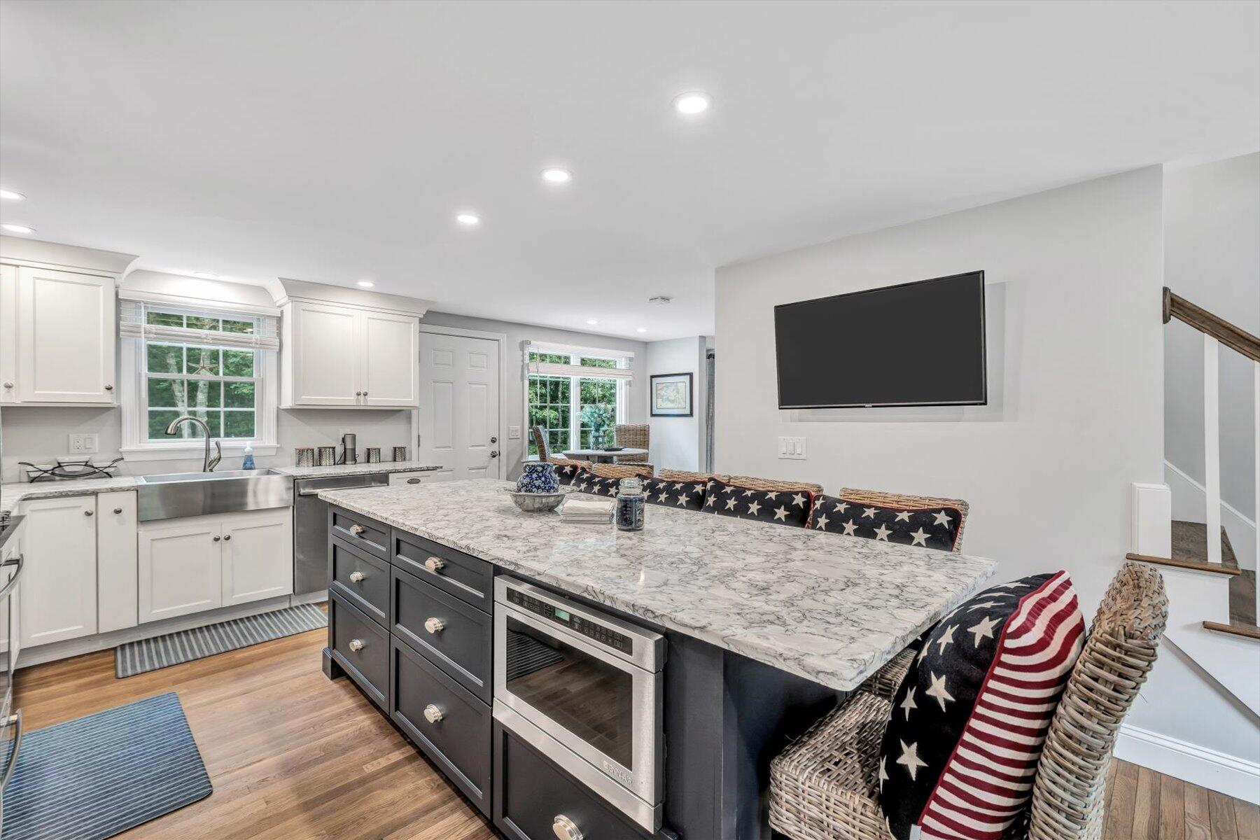 75 The Hunt Circle Mashpee, MA 02649 - Photo 15 of 49 a kitchen with a stove and a sink