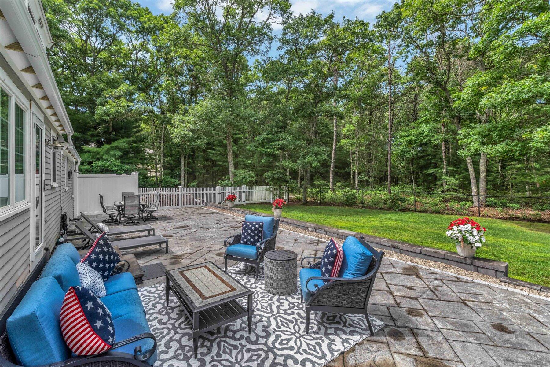 75 The Hunt Circle Mashpee, MA 02649 - Photo 37 of 49 a view of a patio with chairs and a table