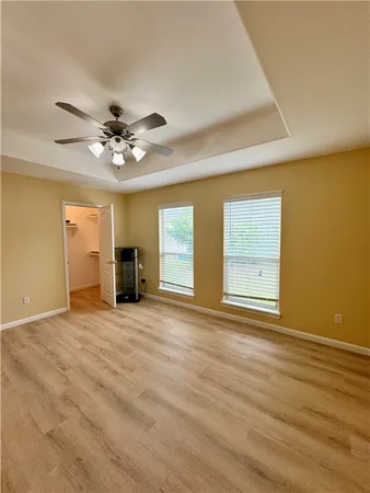 a spacious bathroom with a tub and shower