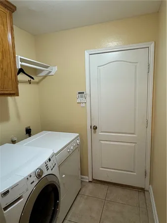 a view of a balcony with refrigerator