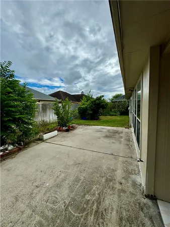 a view of a house with a yard and garage