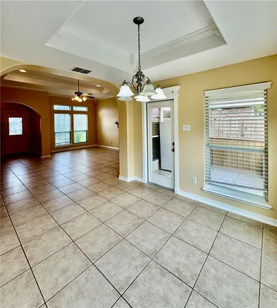 a view of a room with window and chandelier