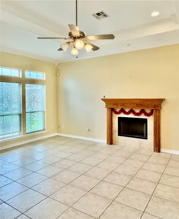 a view of an empty room with a fireplace
