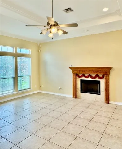 a view of an empty room with a fireplace