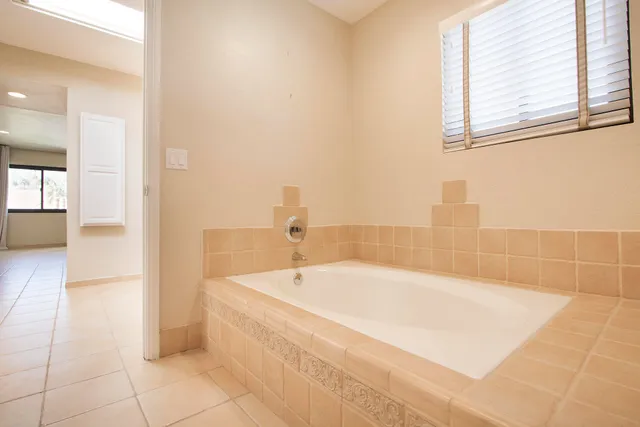 a bathroom with a mirror and a sink