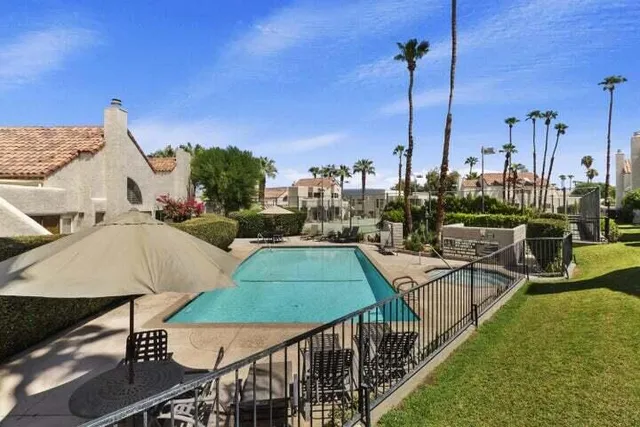 a view of a swimming pool with a patio