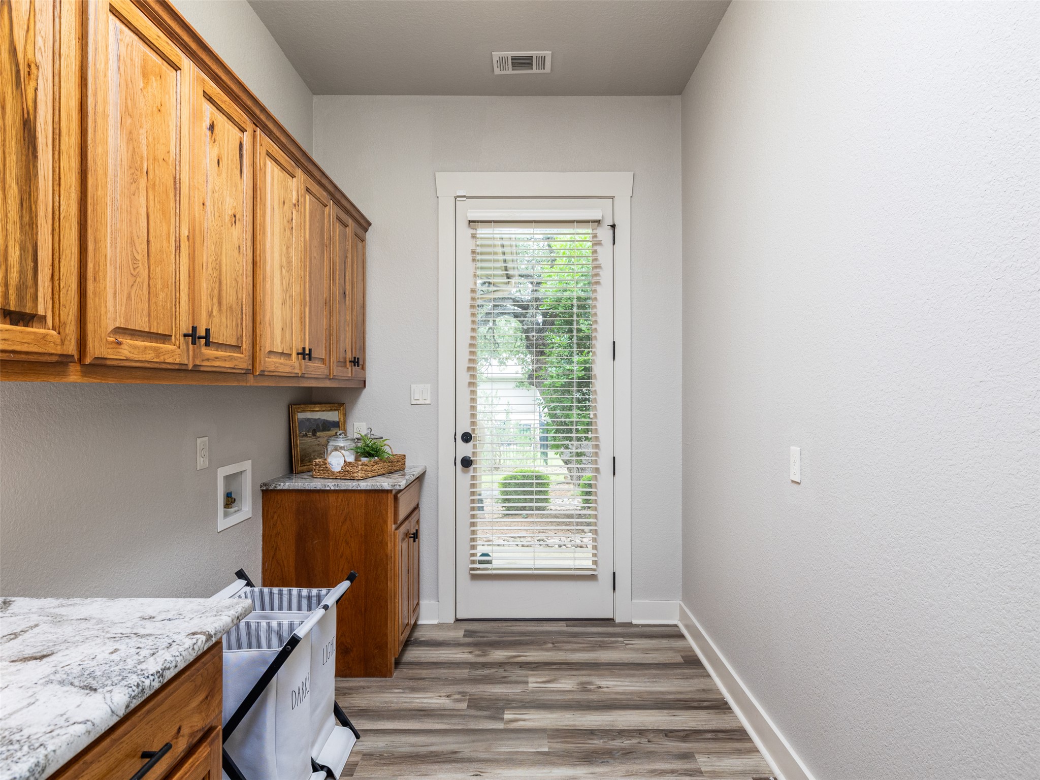 101 Aldea Street Georgetown, TX 78633 - Photo 22 of 40 The laundry room has room for a fridge or stand-up freezer to fit in a nook within the laundry room.