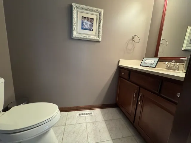 a bathroom with a toilet and a sink