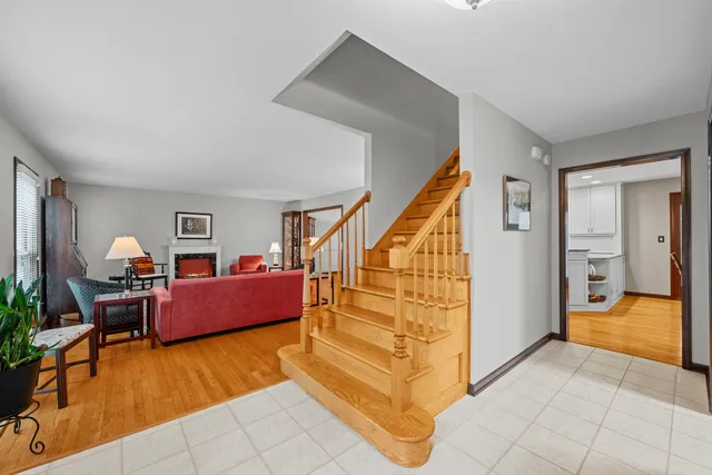 a living room with furniture and a dining table