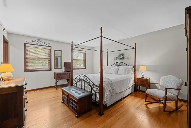 a bedroom with furniture and a window