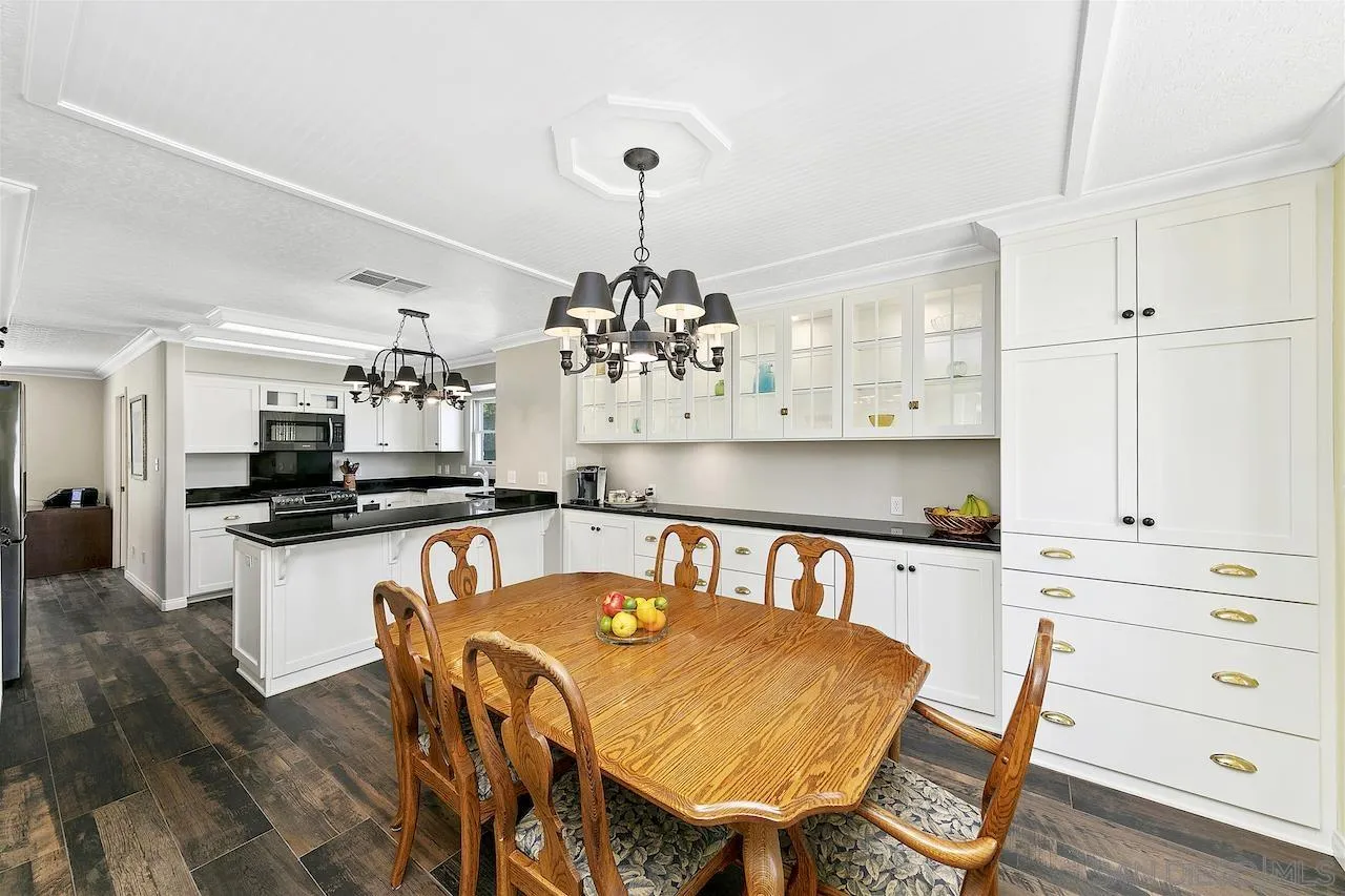 28659 Old Highway 80 Pine Valley, CA 91962 - Photo 13 of 55 a kitchen with kitchen island a table and chairs in it