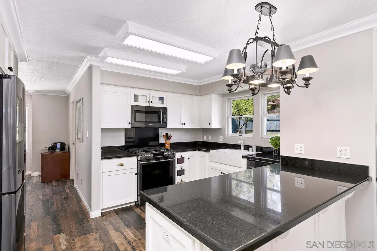 28659 Old Highway 80 Pine Valley, CA 91962 - Photo 14 of 55 a kitchen with stainless steel appliances granite countertop a sink a stove and cabinets