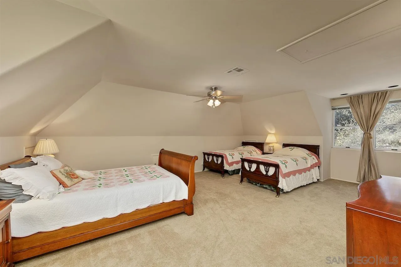 28659 Old Highway 80 Pine Valley, CA 91962 - Photo 33 of 55 a bedroom with a bed and a chandelier