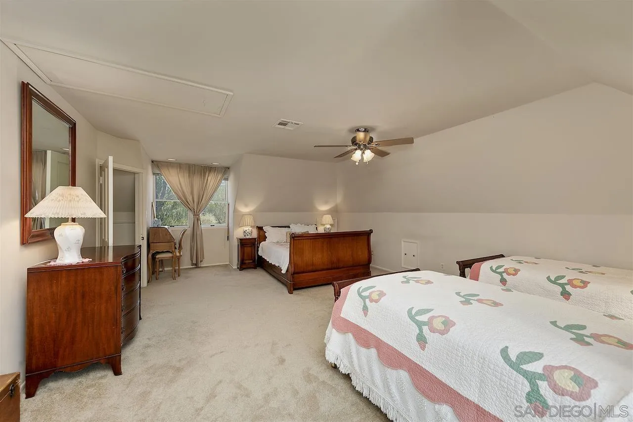 28659 Old Highway 80 Pine Valley, CA 91962 - Photo 34 of 55 a bed sitting in a bedroom next to a window and a chandelier