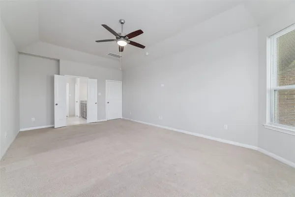 a view of empty room with windows