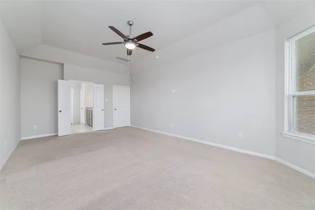 a view of empty room with windows