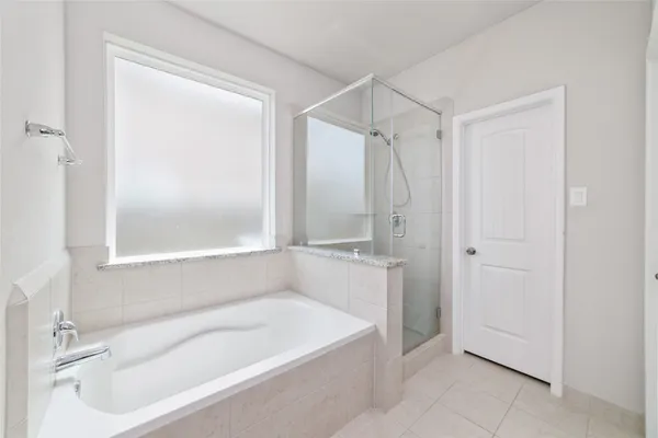 a white bath tub sitting in a bathroom