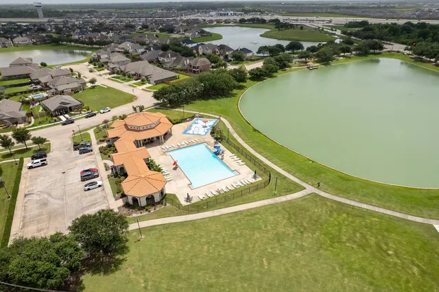 an aerial view of a house with a lake view