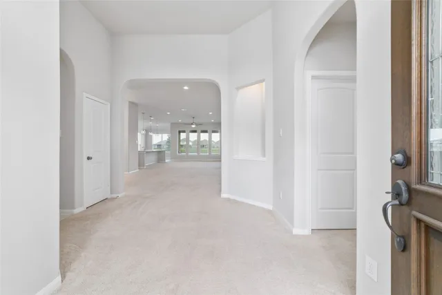 a view of a room with large windows