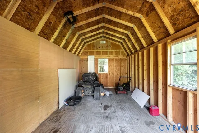a view of a room with gym equipment and a large window