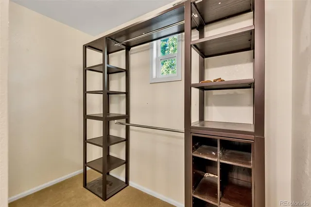 a view of staircase with wooden floor and a window