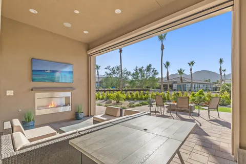 a living room with hardwood floor and large window