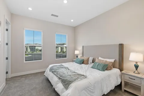 a bedroom with bed and window