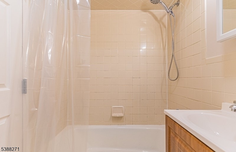 110 Cornelia Street, Unit 3 Boonton, NJ 07005 - Photo 2 of 3 a bathroom with a shower and a sink