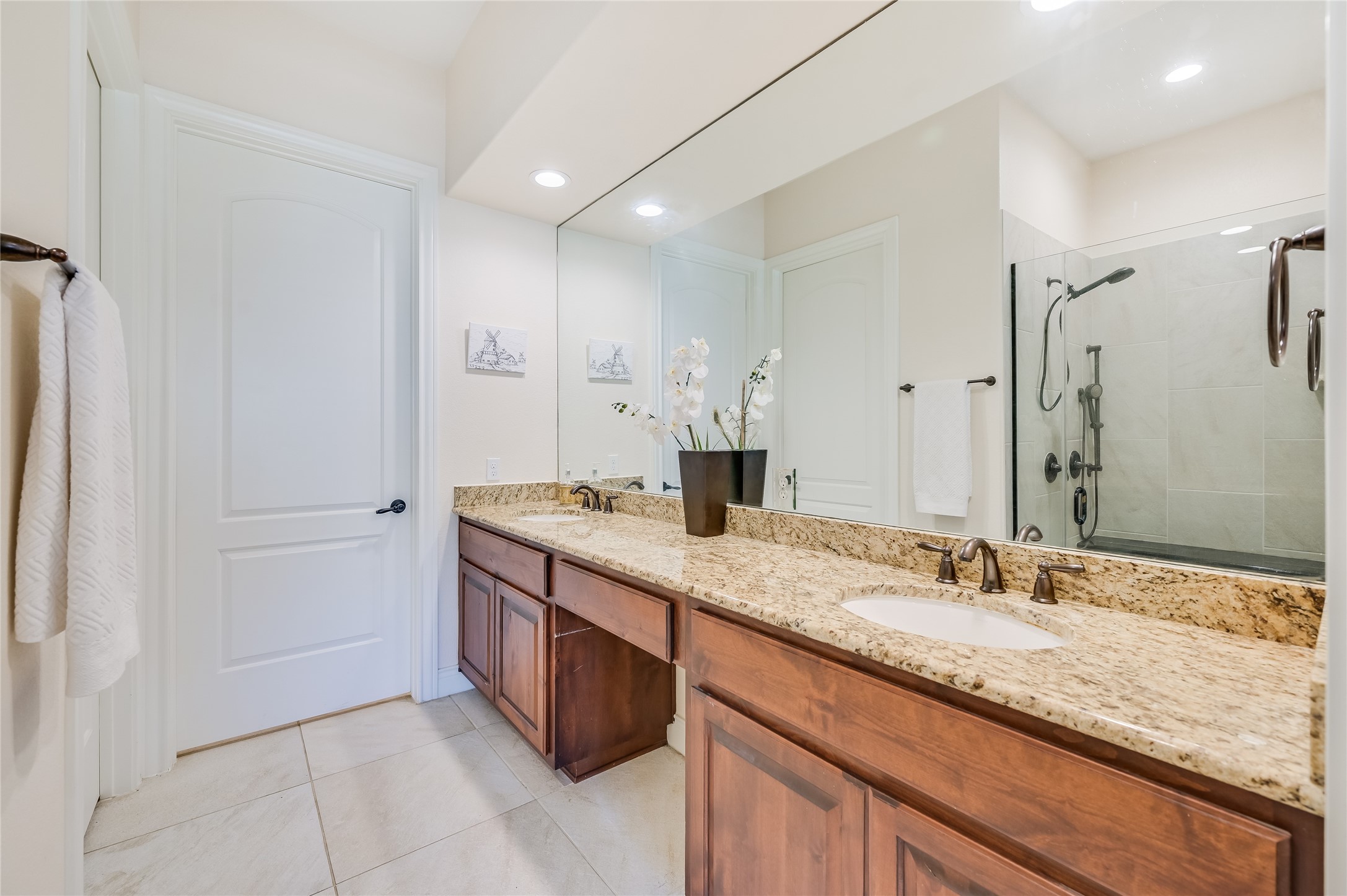 104-2 Rivalto Circle, Unit 1 Lakeway, TX 78734 - Photo 14 of 27 Full bath with double vanity, a walk in shower, tile floor and recessed lighting