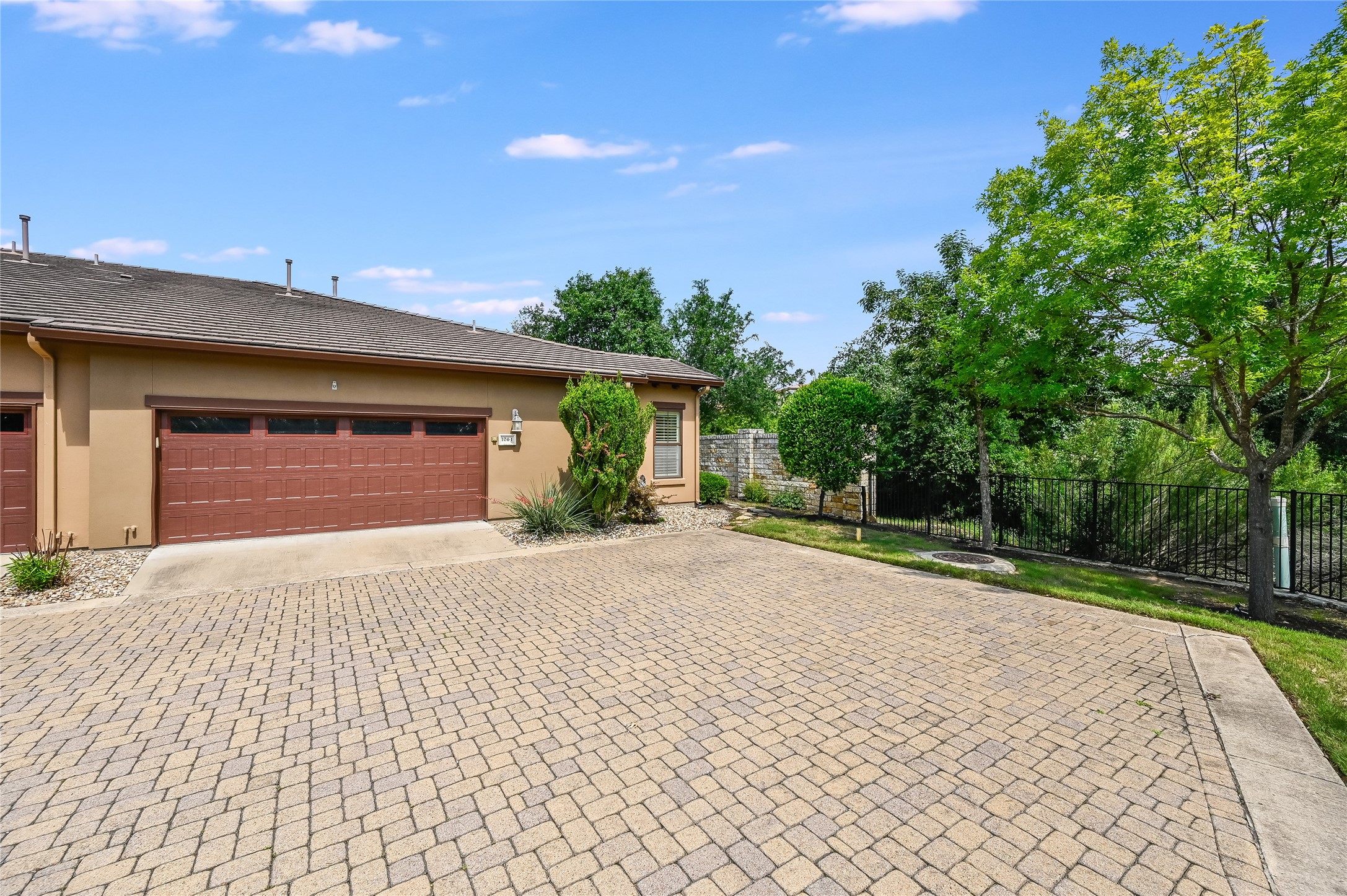104-2 Rivalto Circle, Unit 1 Lakeway, TX 78734 - Photo 18 of 27 Double garage with extra storage space and several guest parking spaces