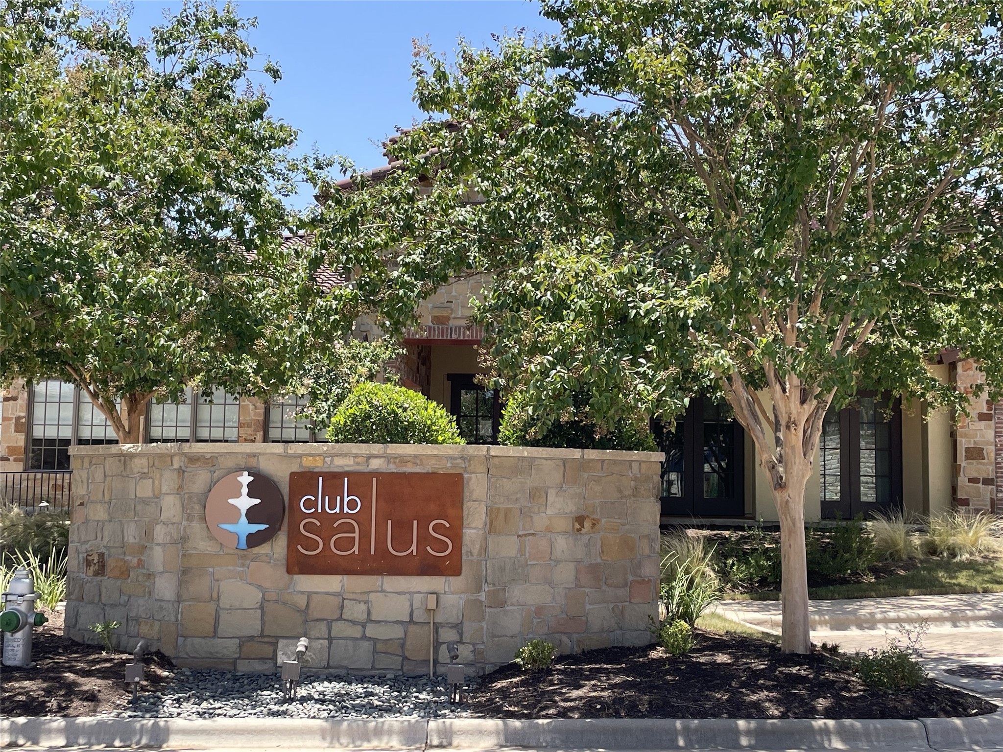 104-2 Rivalto Circle, Unit 1 Lakeway, TX 78734 - Photo 20 of 27 Community clubhouse sign