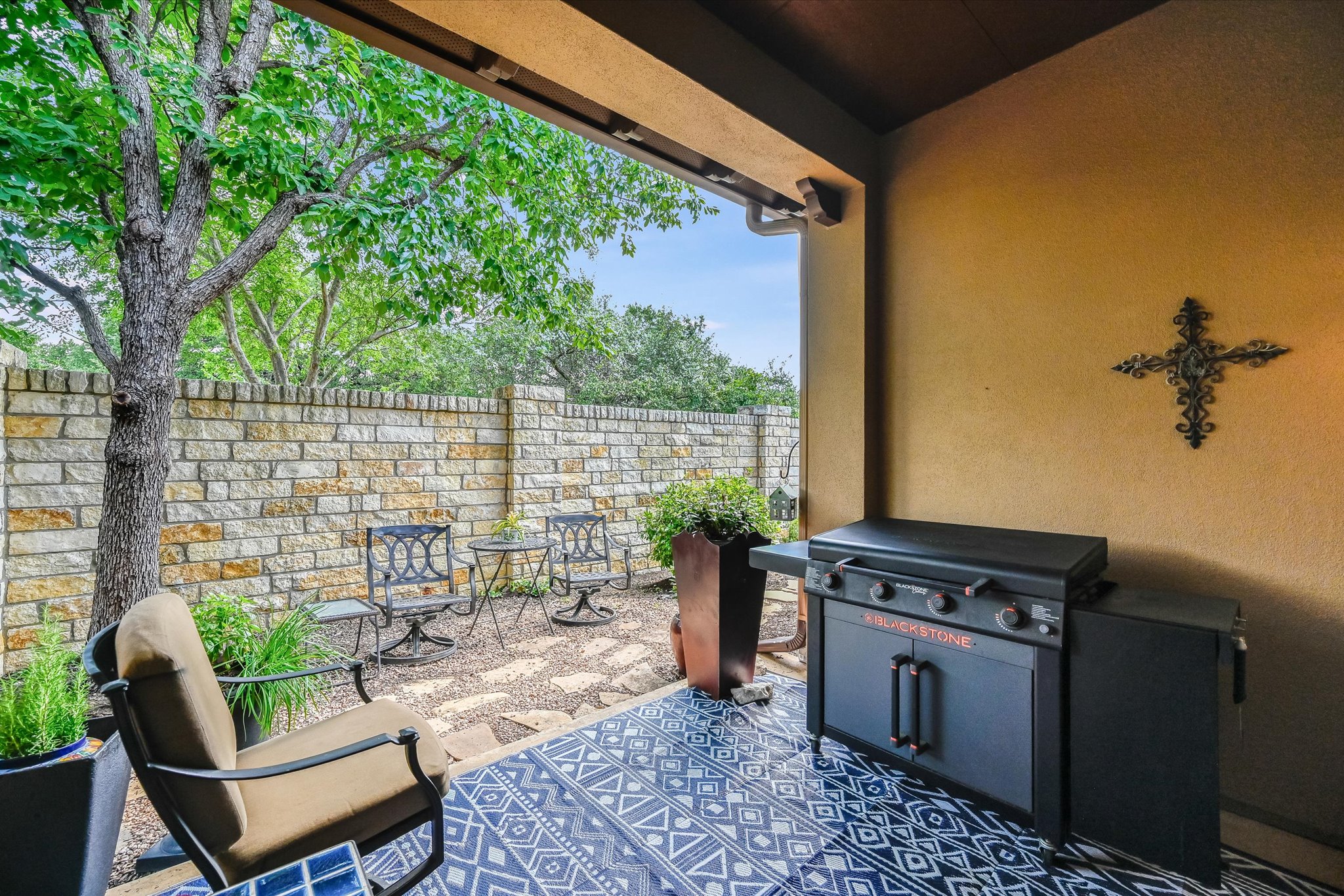 104-2 Rivalto Circle, Unit 1 Lakeway, TX 78734 - Photo 2 of 27 Private covered patio that is open to the garden area