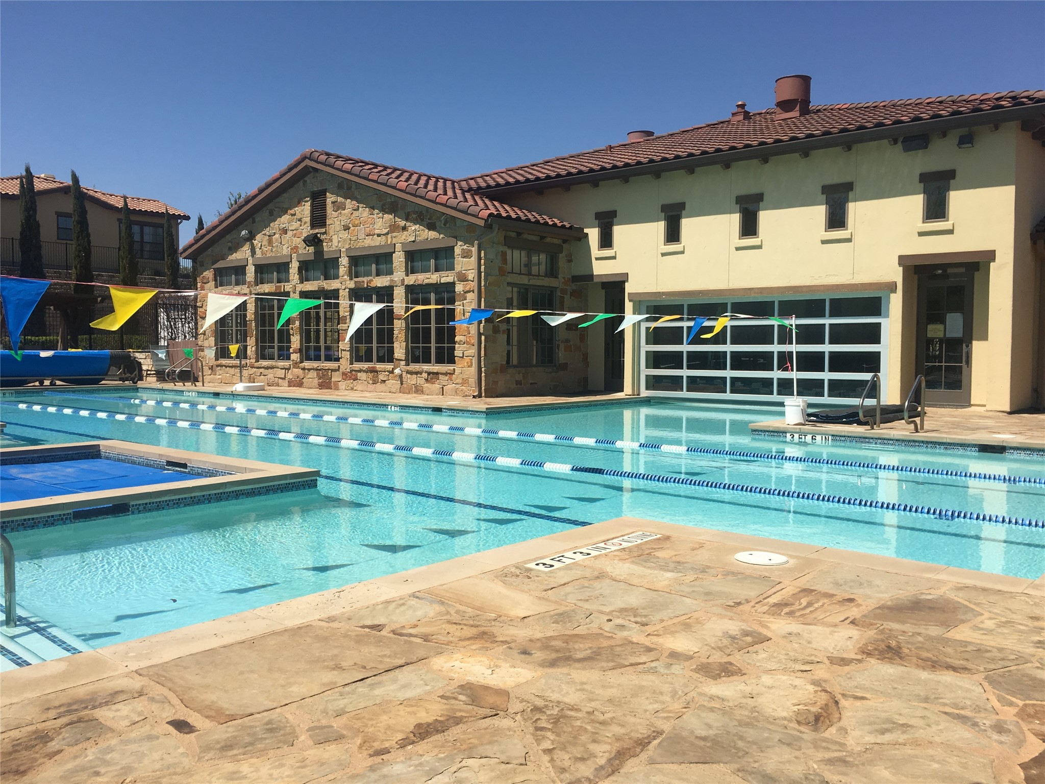 104-2 Rivalto Circle, Unit 1 Lakeway, TX 78734 - Photo 22 of 27 Community pool and spa with ample patio areas