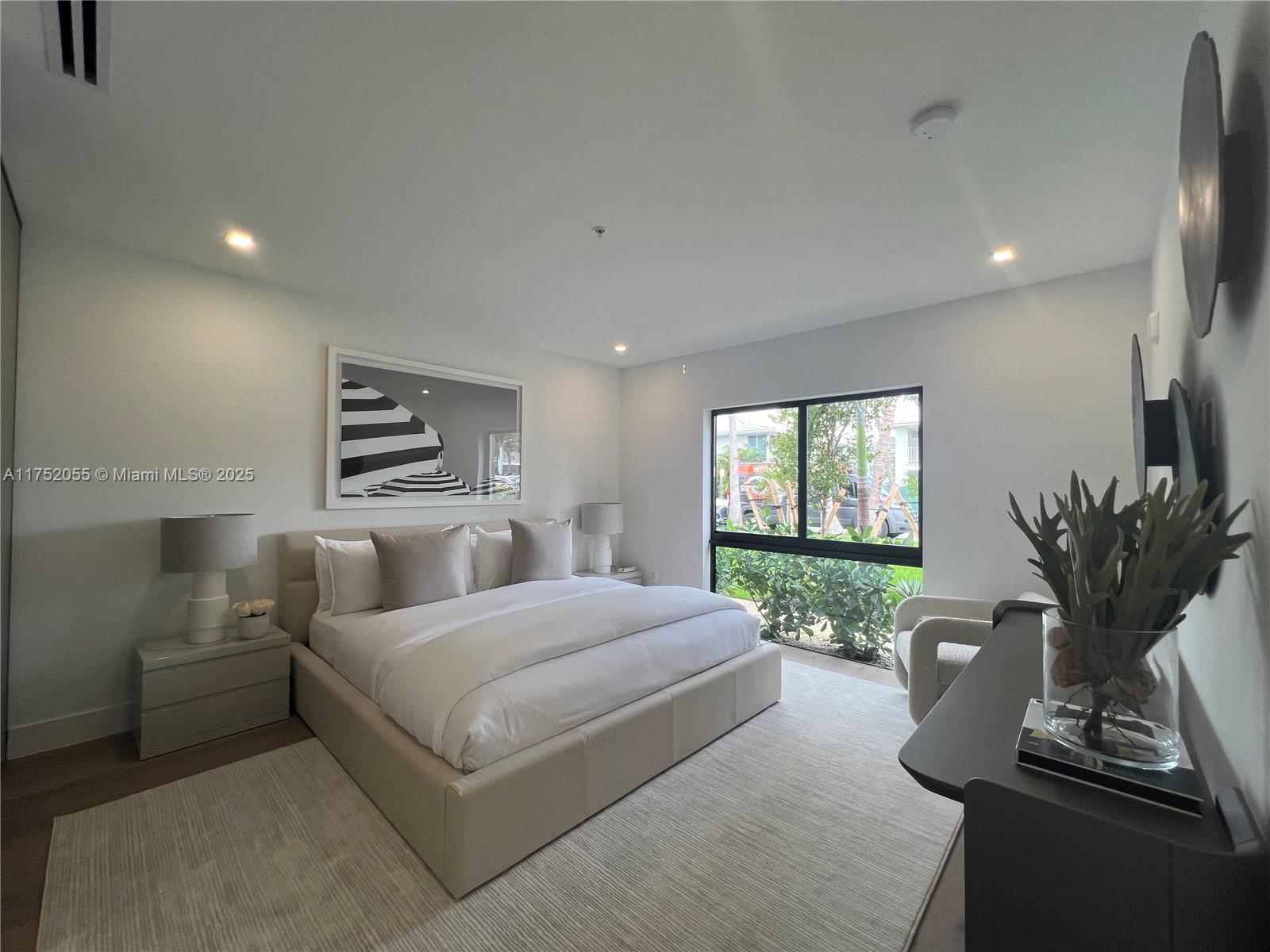 200 Sunrise Drive, Unit 200C Key Biscayne, FL 33149 - Photo 15 of 16 a bed room with a bed and a potted plant