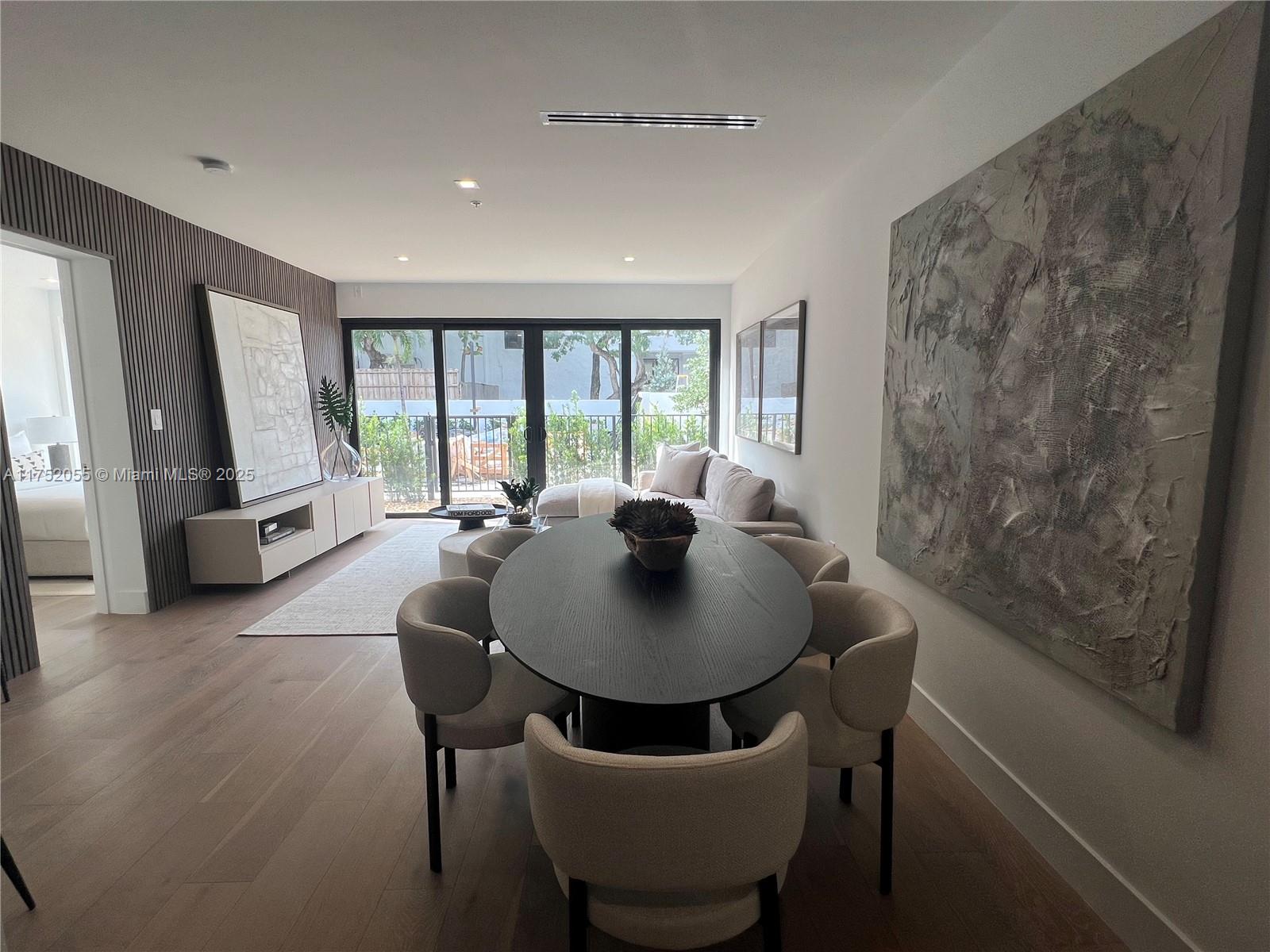 200 Sunrise Drive, Unit 200C Key Biscayne, FL 33149 - Photo 3 of 16 a view of a dining room with furniture window and outside view