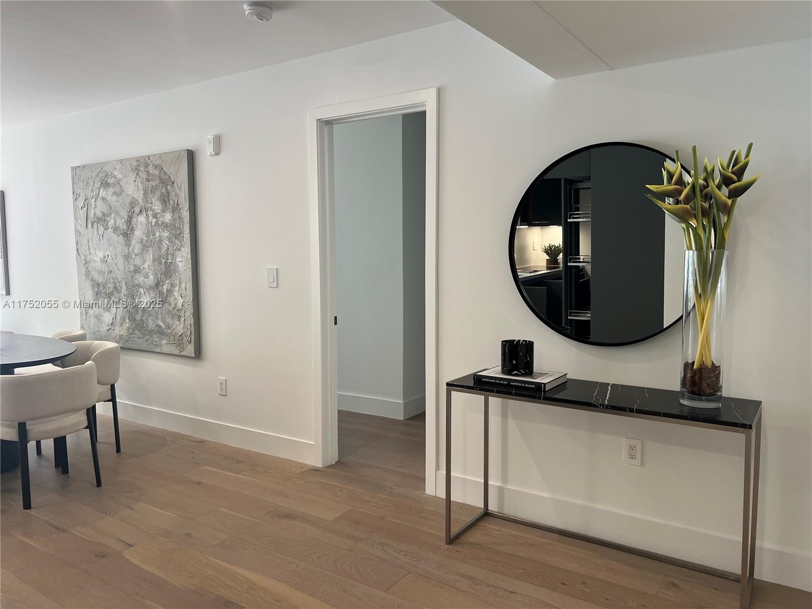 200 Sunrise Drive, Unit 200C Key Biscayne, FL 33149 - Photo 4 of 16 a view of a livingroom with furniture and wooden floor