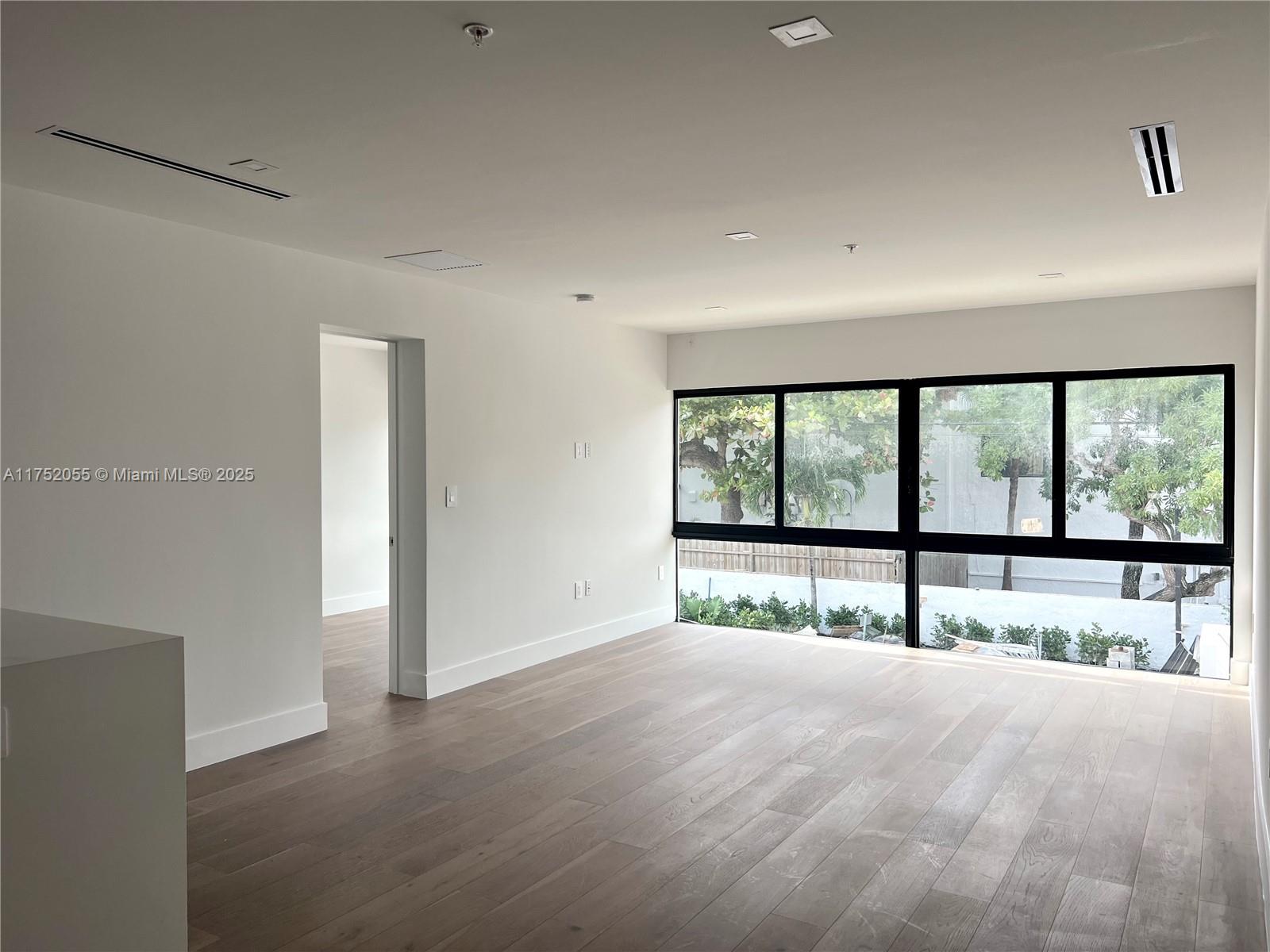 200 Sunrise Drive, Unit 200C Key Biscayne, FL 33149 - Photo 5 of 16 a view of an empty room with a large window