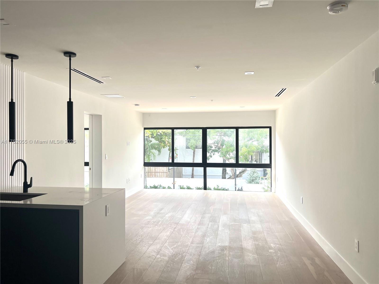 200 Sunrise Drive, Unit 200C Key Biscayne, FL 33149 - Photo 6 of 16 a view of an empty room with a window