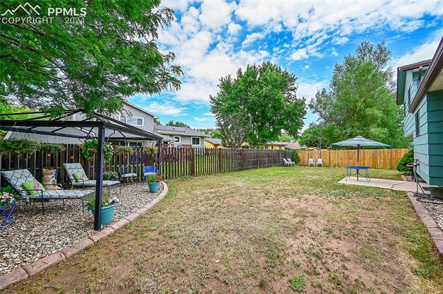 5255 Pinon Valley Road Colorado Springs, CO 80919 - Photo 34 of 47 View of yard featuring a patio area and a gazebo