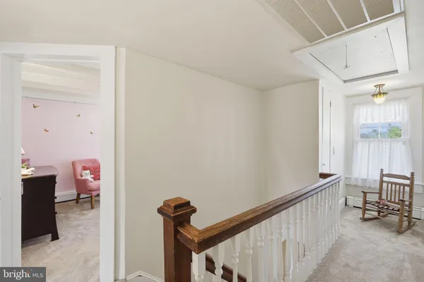 a view of a hallway with workspace