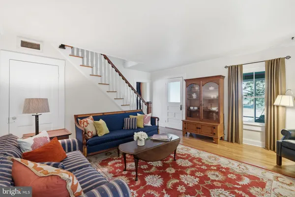 a living room with furniture and a rug