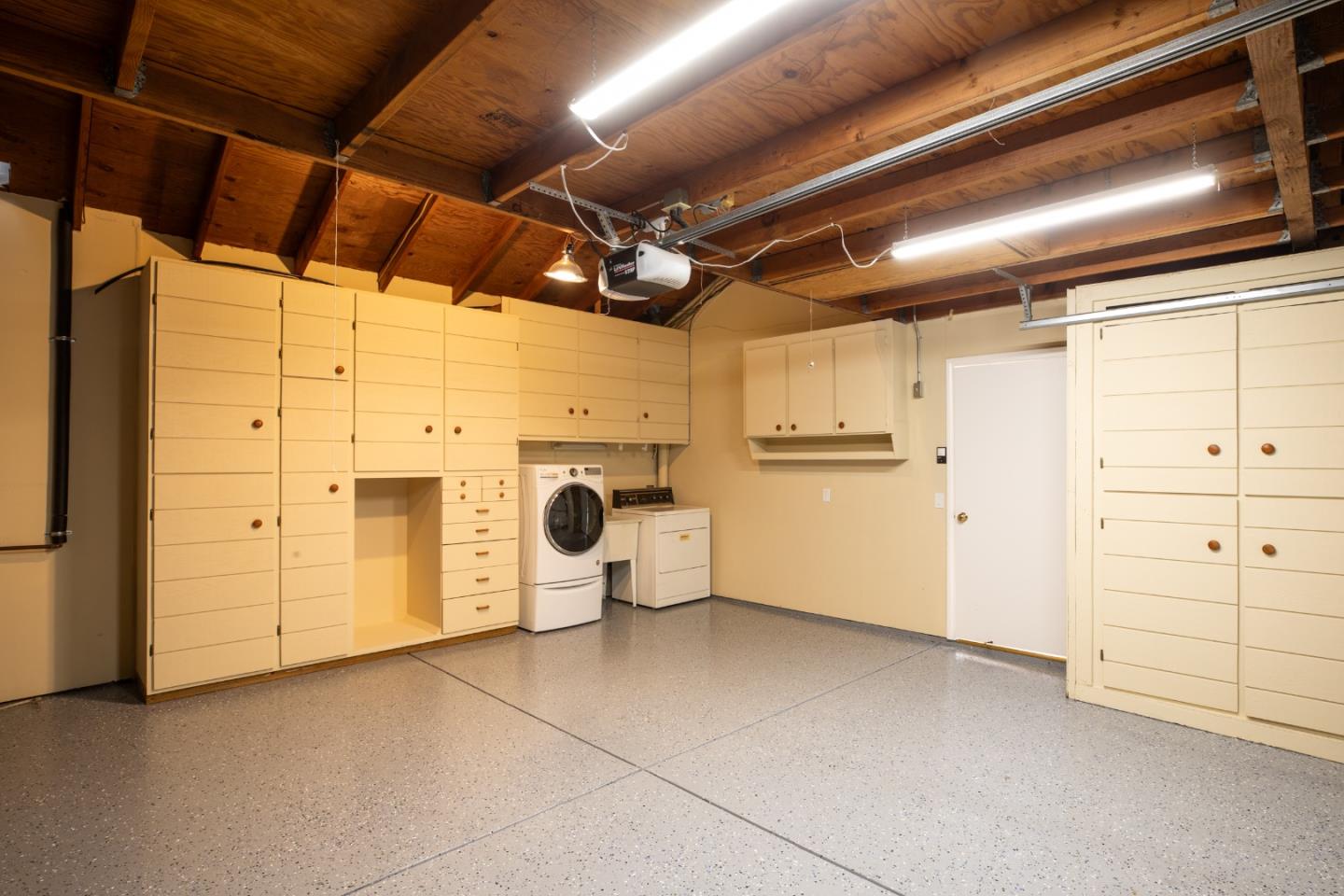 71 Bay Tree Lane Los Altos, CA 94022 - Photo 20 of 32 a view of a storage & utility room with washing machine