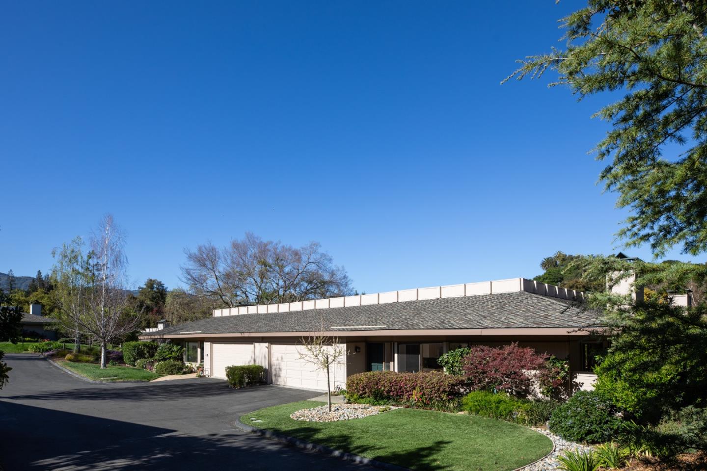 71 Bay Tree Lane Los Altos, CA 94022 - Photo 2 of 32 a front view of a house with a garden