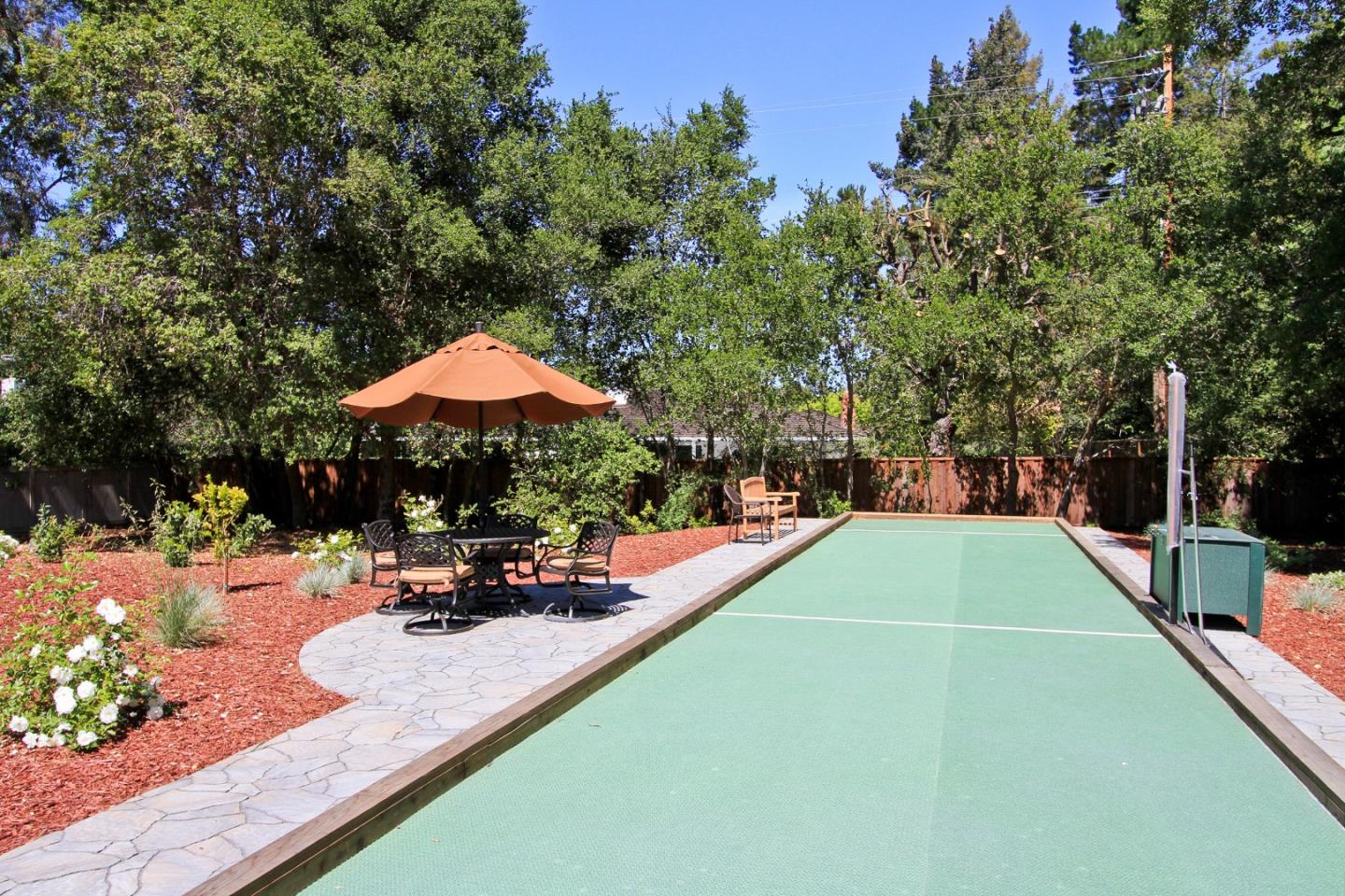 71 Bay Tree Lane Los Altos, CA 94022 - Photo 26 of 32 an outdoor space with furniture and umbrella