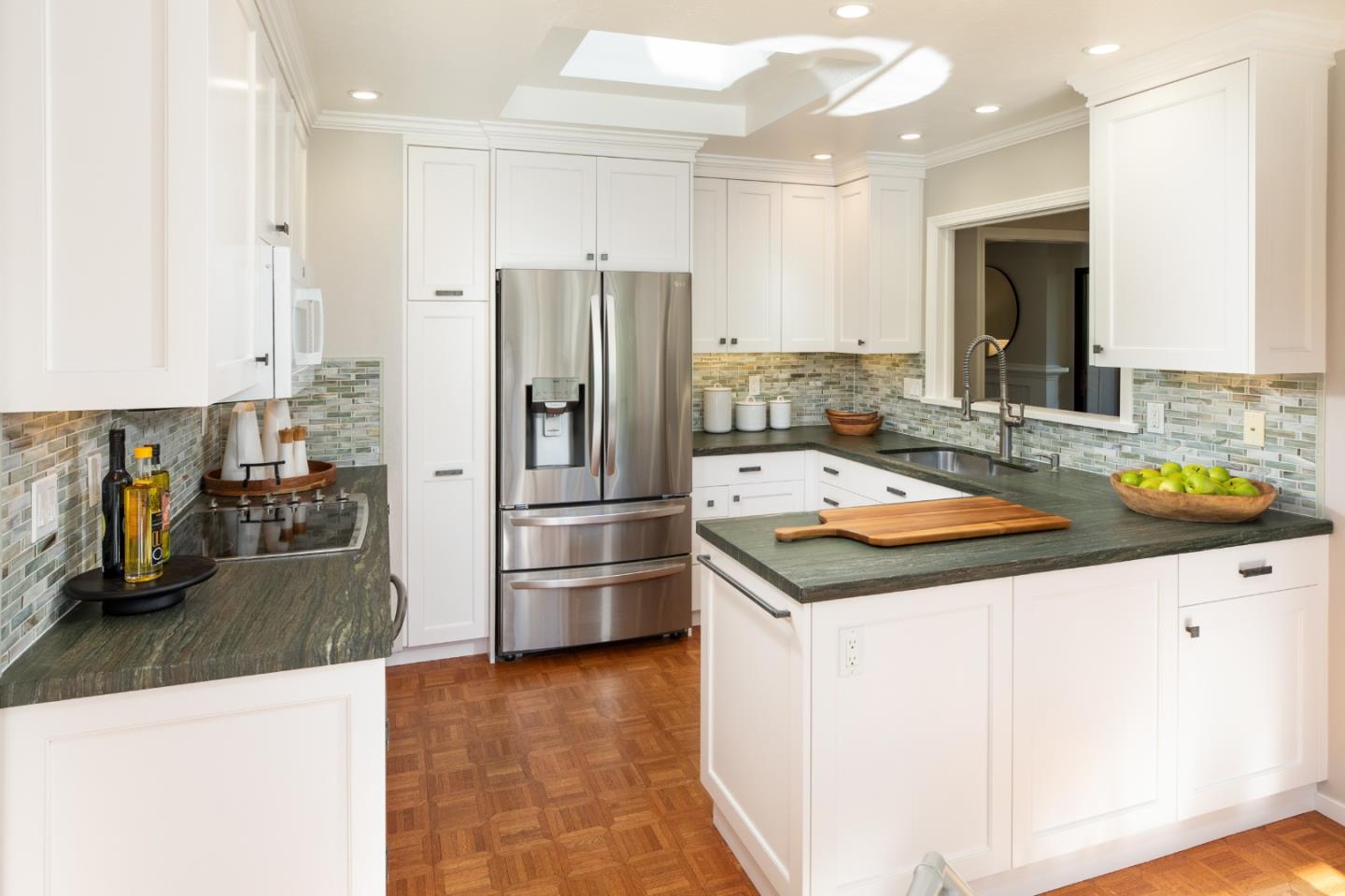 71 Bay Tree Lane Los Altos, CA 94022 - Photo 4 of 32 a kitchen with stainless steel appliances a sink and a refrigerator