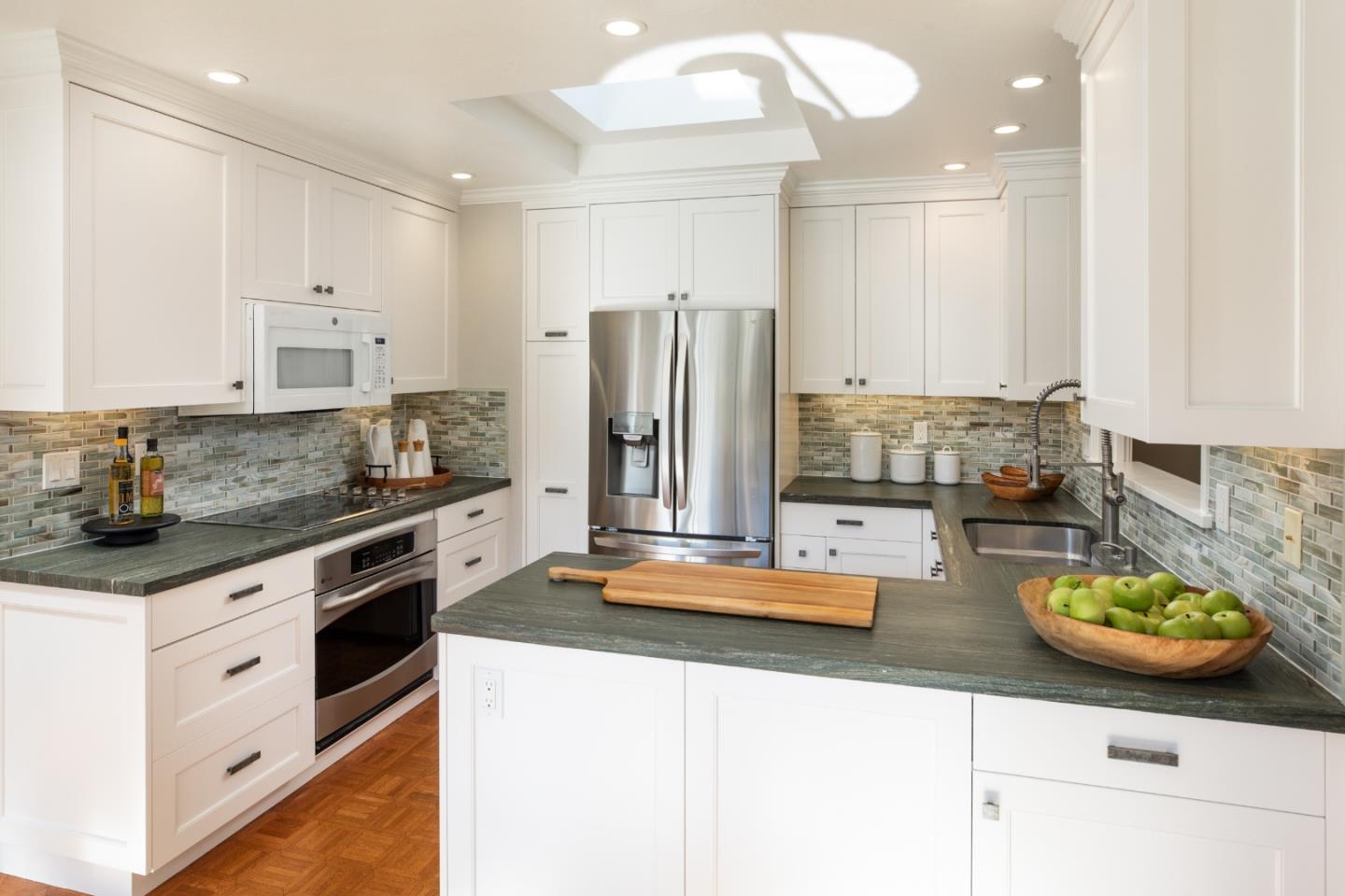 71 Bay Tree Lane Los Altos, CA 94022 - Photo 6 of 32 a kitchen with sink a stove and cabinets