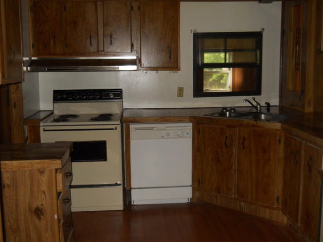 3381 Irish Road Chatham, VA 24531 - Photo 10 of 15 a kitchen with granite countertop cabinets stove and sink