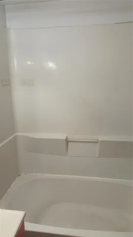 a view of a bathtub in bathroom