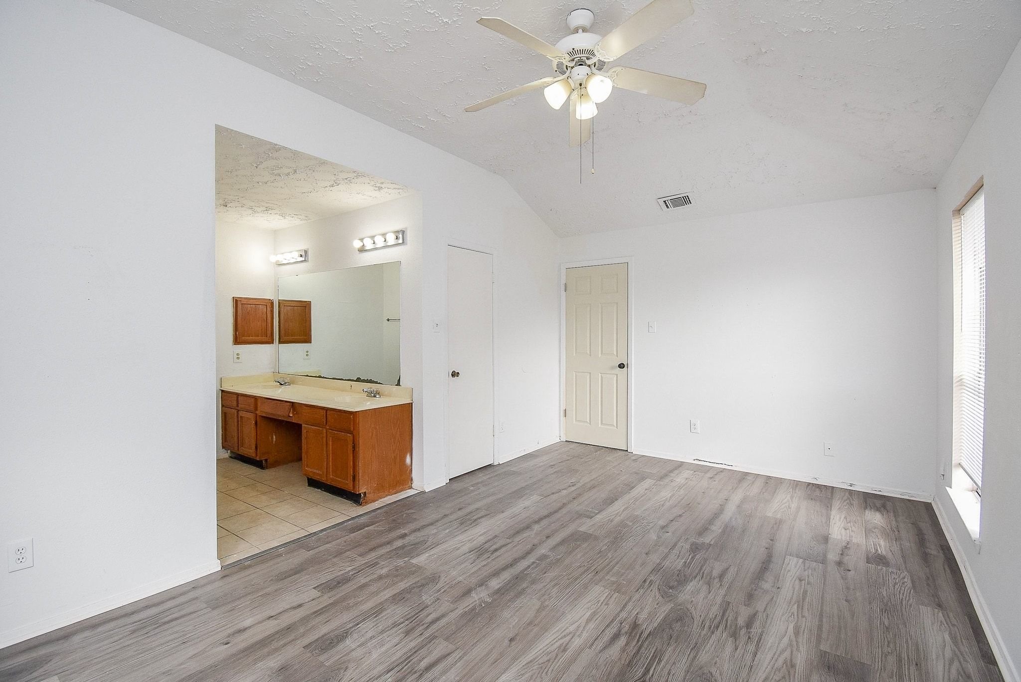 16330 Meadowbrook Farm Road Houston, TX 77082 - Photo 11 of 20 a view of a kitchen with granite countertop cabinets and wooden floor
